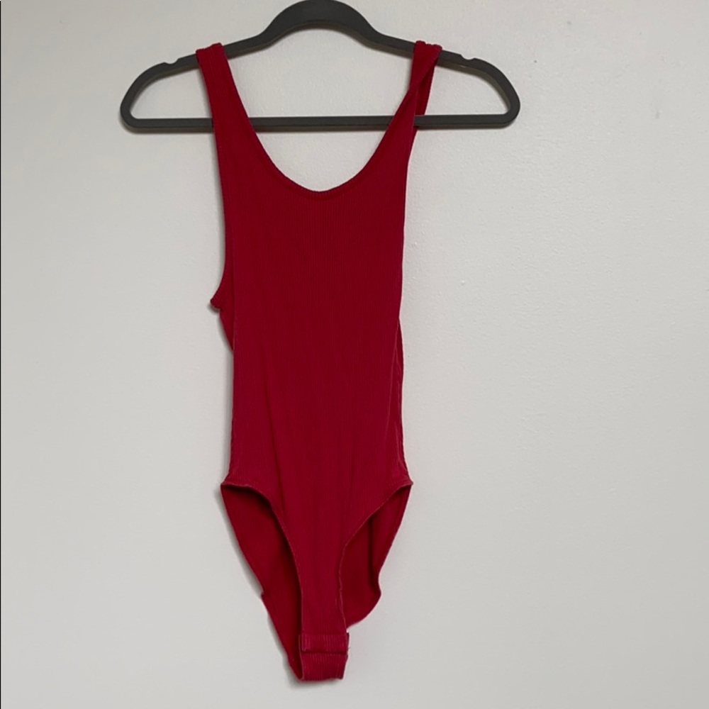 Out from under red body suit